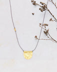 River Song golden half moon talisman  necklace.